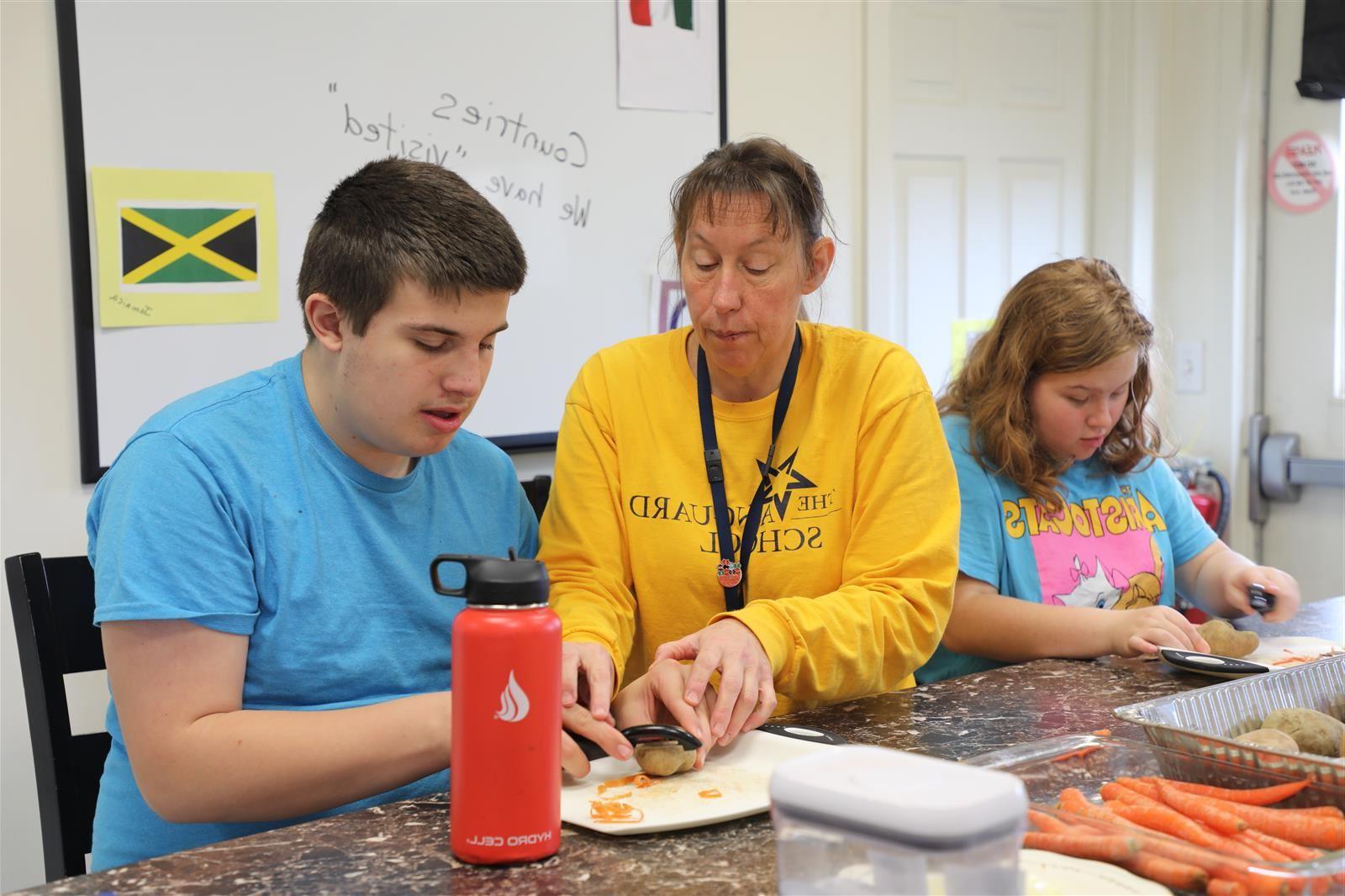  Students cooking with staff